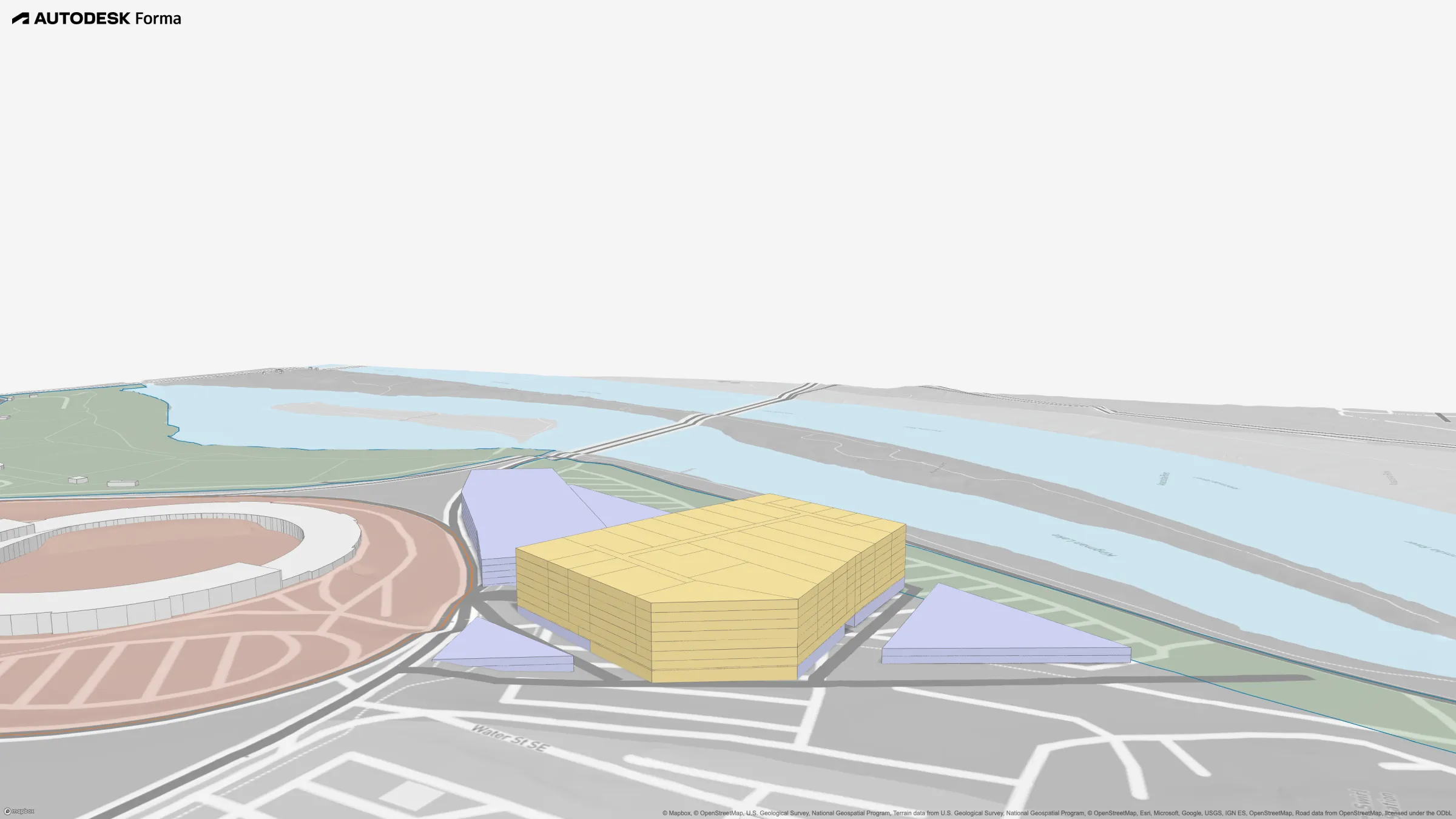 Riverfront Mixed-Use Massing (Autodesk Forma): Mixed-use block and supporting parking along the river edge, south of the stadium.