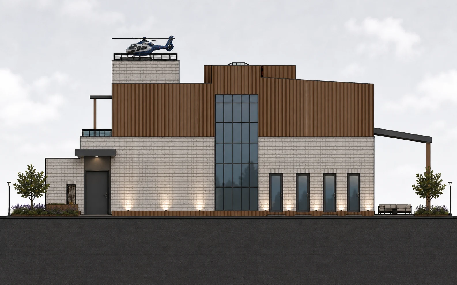 East Elevation: Glazed stair tower between the masonry base and timber upper volume.