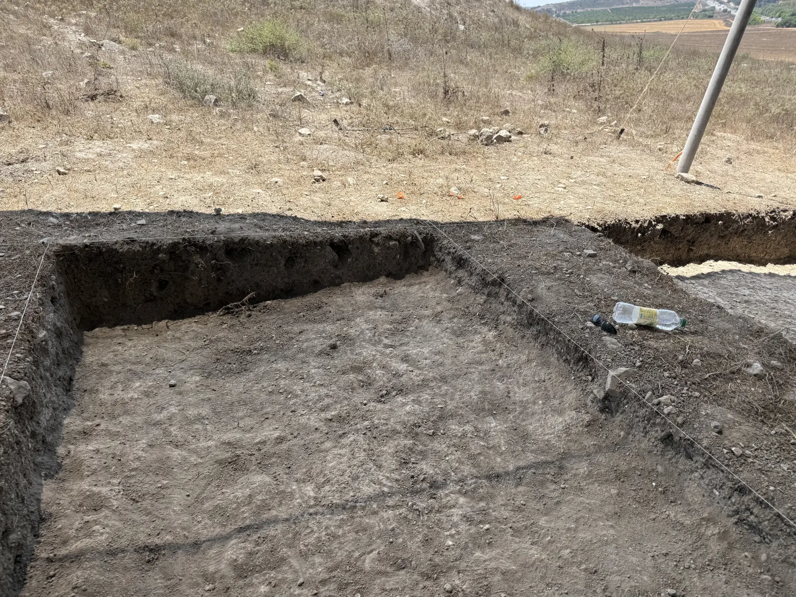 Tel Hanaton: An excavated square with clean section faces for stratigraphic recording.